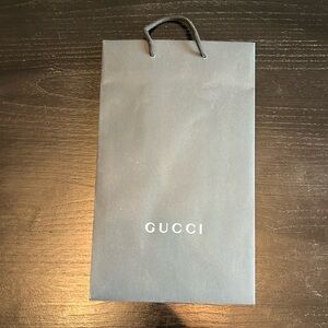 Black Gucci shopping bag